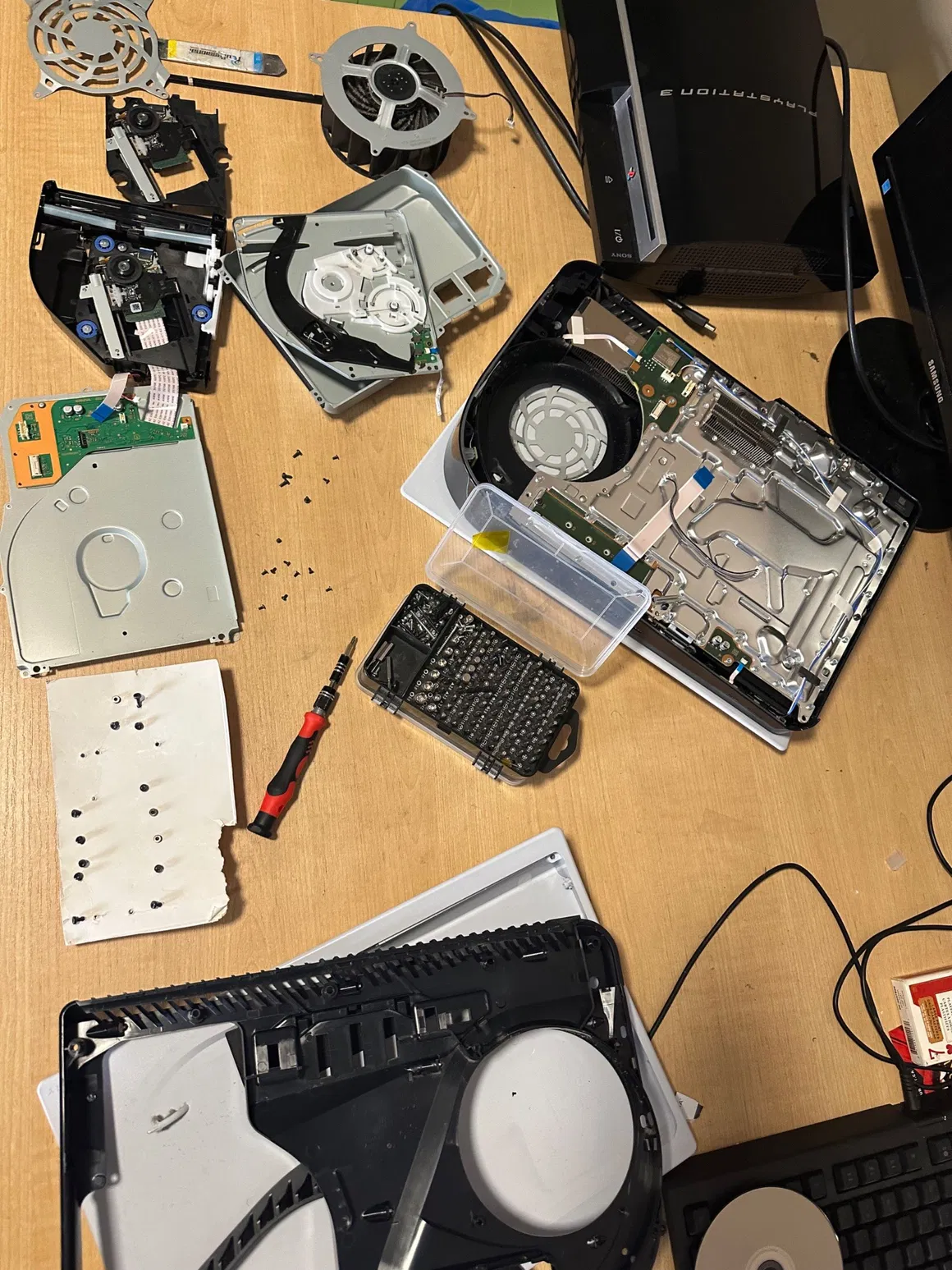A PlayStation 5 fully disassembled during repair
