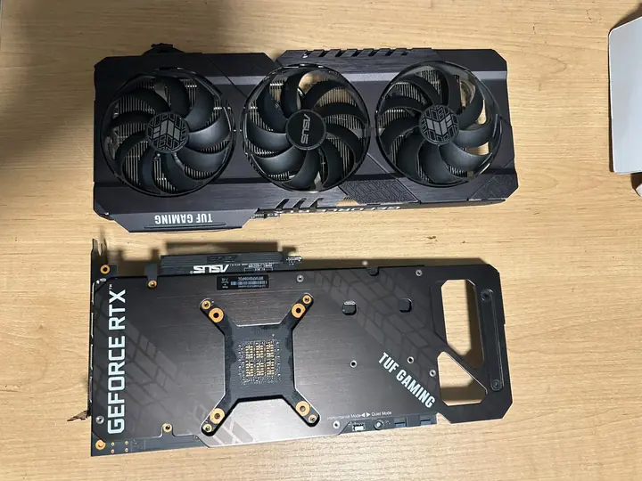 ASUS graphics card shown from the fan side and backplate side during inspection