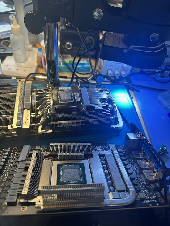 GPU core and heatsink inspected on the repair bench