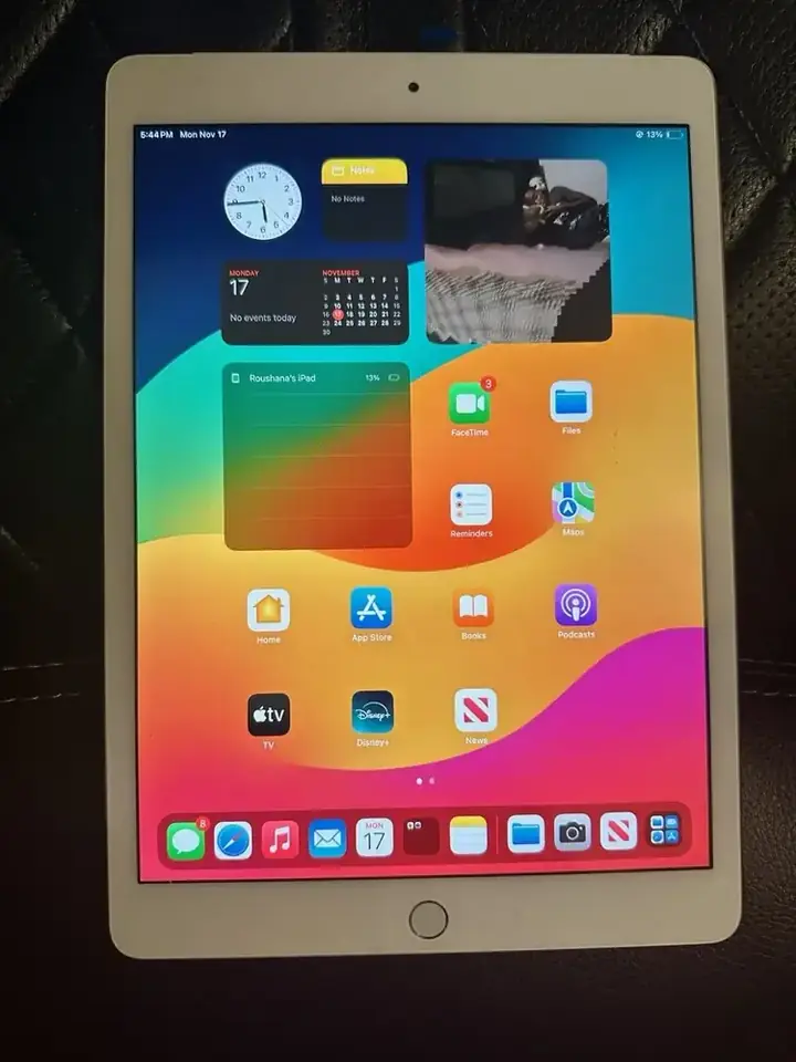 iPad mini powered on at the Home screen after a completed screen repair