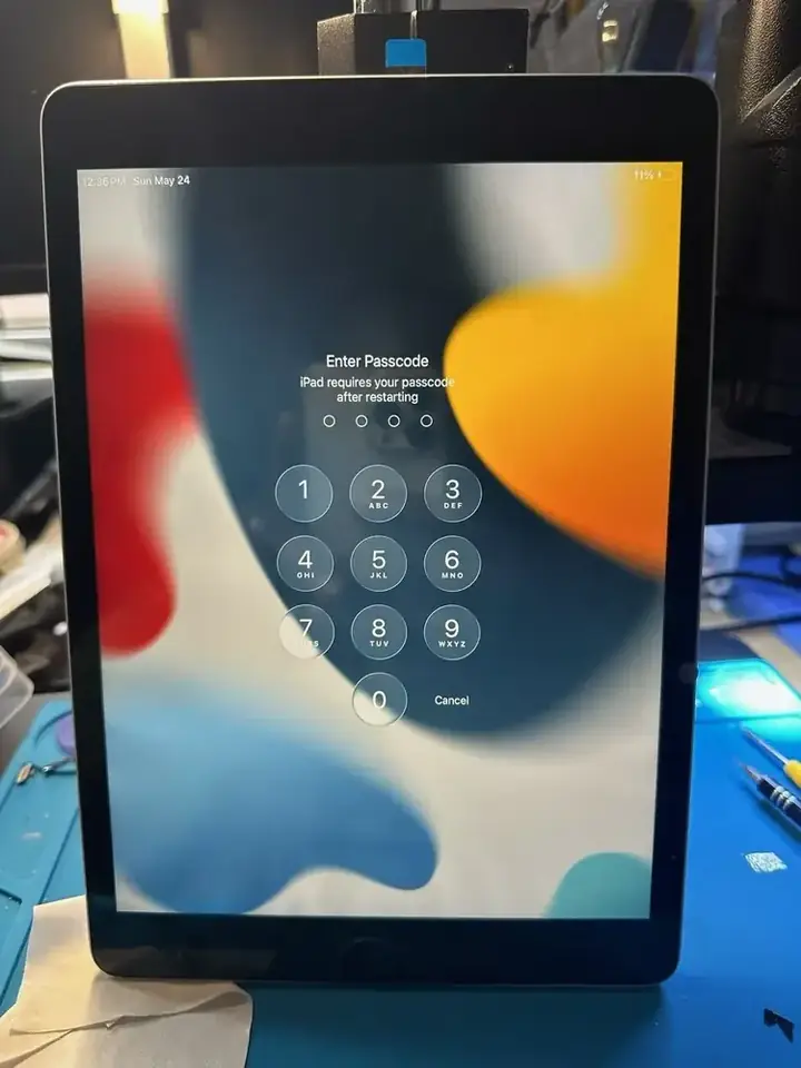 iPad passcode screen used to verify display and touch response after repair