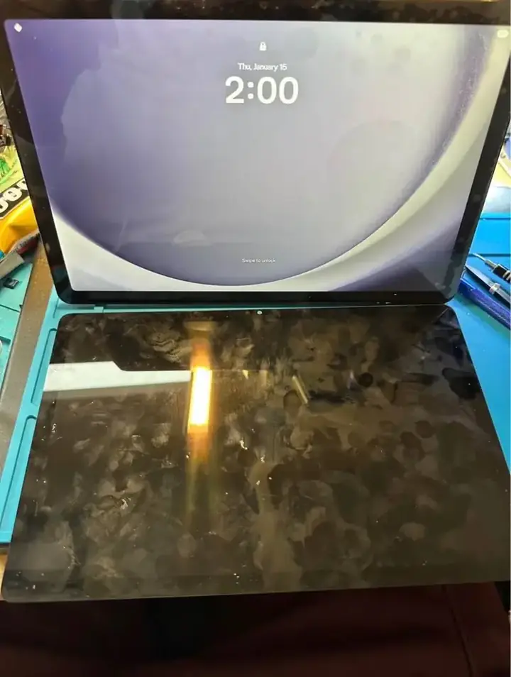 Samsung Galaxy Tab replacement display fitted above the damaged original screen