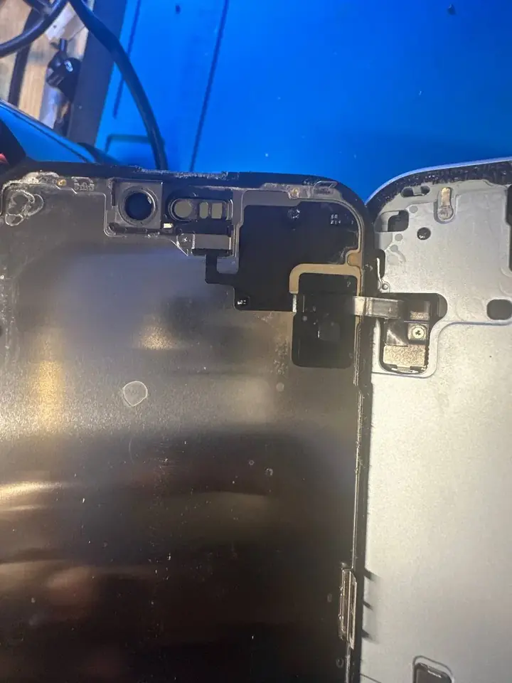 iPhone front camera and sensor flex at the top of an opened phone