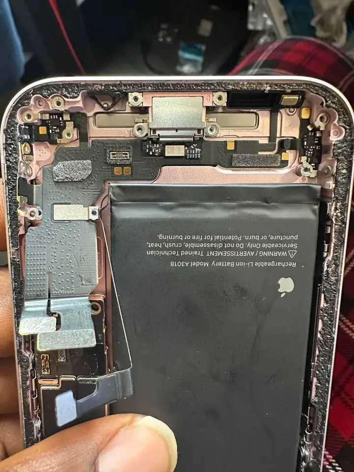 iPhone USB-C charging port flex cable lifted out of the frame