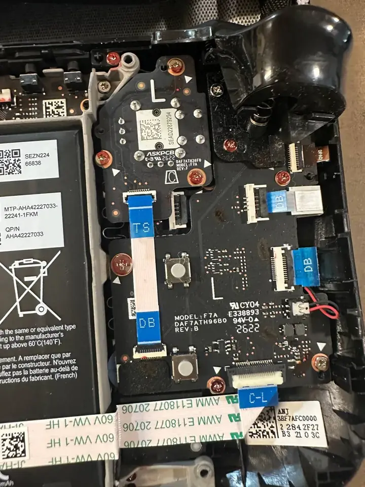 Valve Steam Deck left thumbstick board and battery exposed before stick replacement