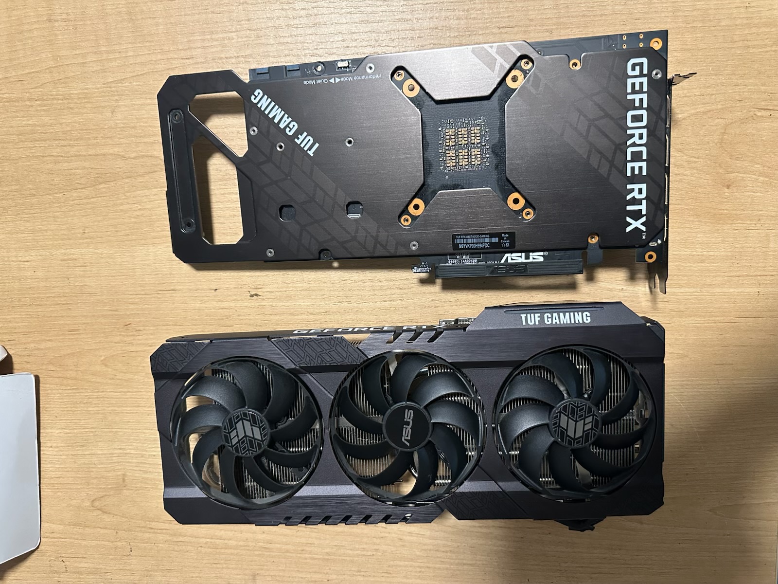 ASUS graphics card shown from the fan side and backplate side during inspection
