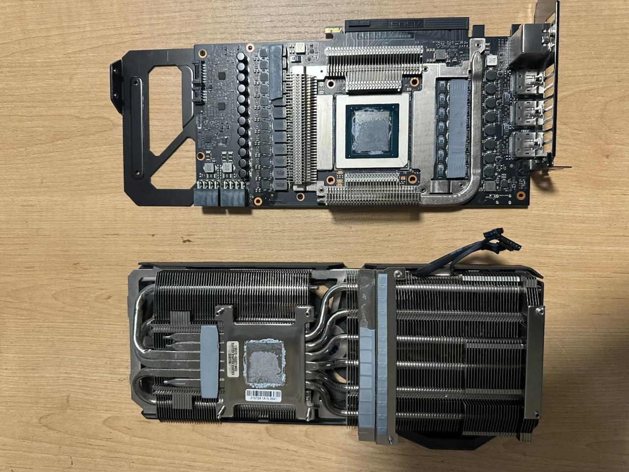 Graphics card cooler and board disassembled for repair on the FlexRepairs bench