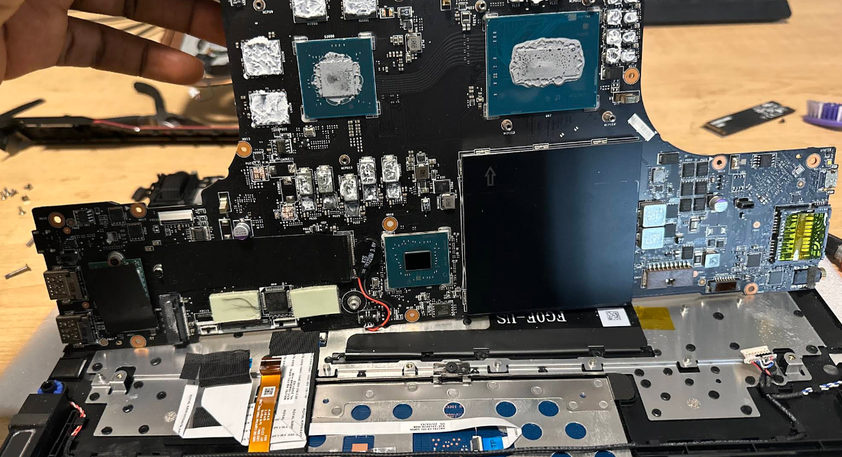 Laptop motherboard inspected during a FlexRepairs computer repair