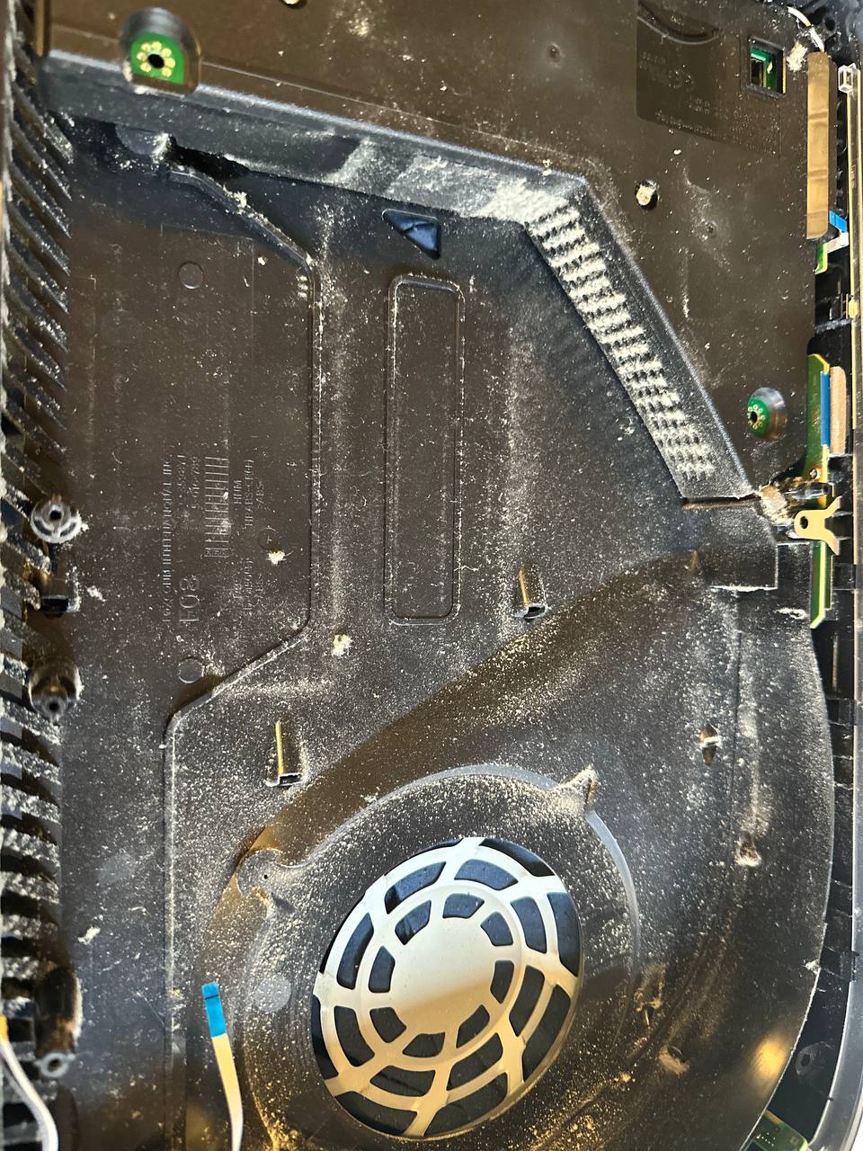 Dusty PlayStation 5 console interior before cleaning