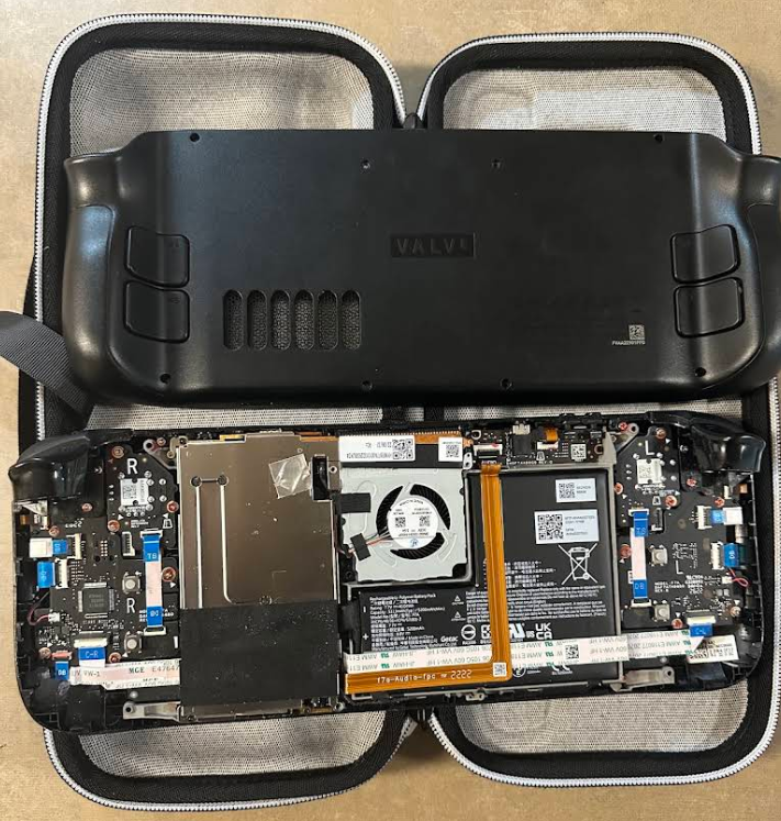 Handheld device opened for internal electronics repair