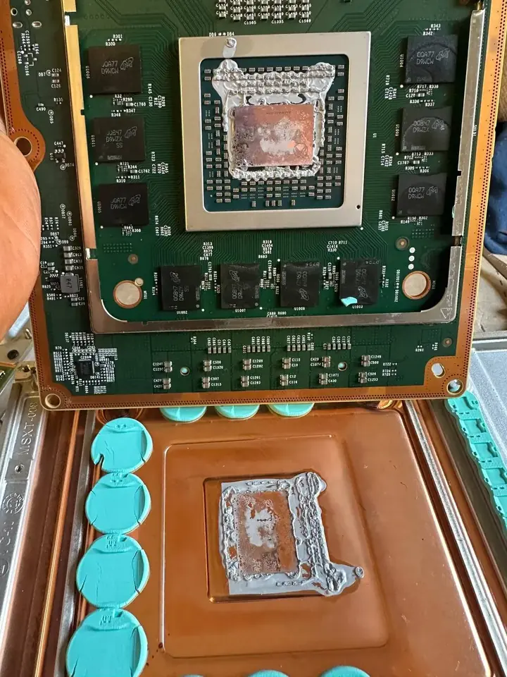 Xbox Series X motherboard opened above its heatsink showing matching old thermal compound patterns
